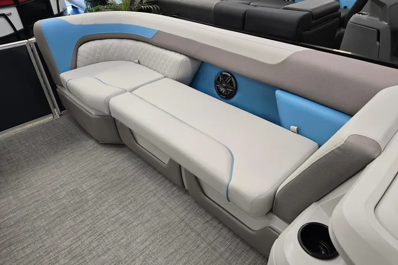 Slide: The Image of 2026 Godfrey Sweetwater 2086 C boat interior with plush seating and integrated speaker system. - 27