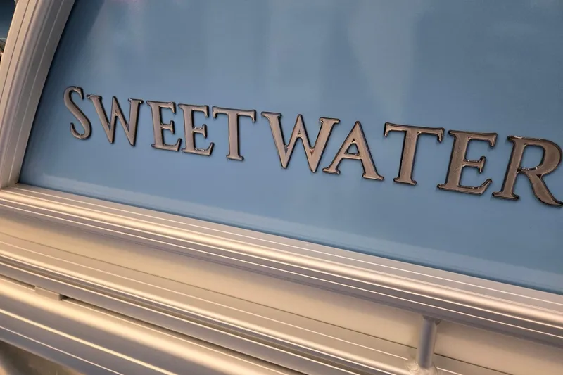 Slide: The Image of Sweetwater 2086 C boat logo on light blue background, Godfrey 2026 model. - 28