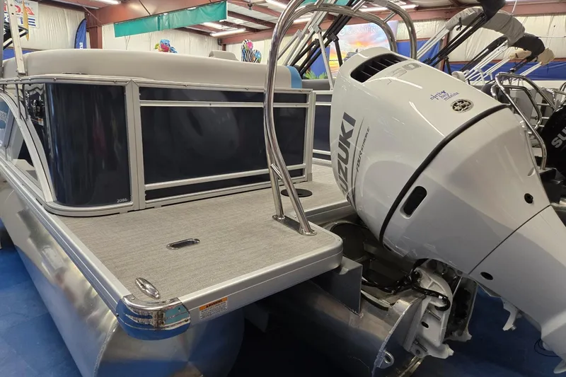 Slide: The Image of 2026 Godfrey Sweetwater 2086 C pontoon boat with Suzuki outboard motor in showroom. - 3