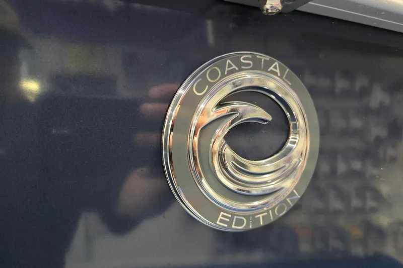Slide: The Image of 2026 Godfrey Sweetwater 2086 C Coastal Edition emblem on dark surface. - 30