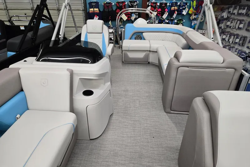 Slide: The Image of 2026 Godfrey Sweetwater 2086 C pontoon boat interior with plush seating and modern design. - 5