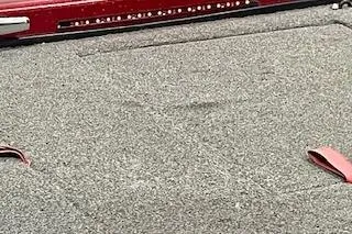 Slide: The Image of Carpeted deck of a 2002 Nitro NX 882 SC boat with red accents. - 10