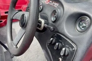 Slide: The Image of Steering wheel and dashboard of a 2002 Nitro NX 882 SC boat. - 13