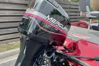 Slide: The Image of 2002 Nitro NX 882 SC boat with Mercury 150 HP engine, parked outdoors. - 16