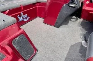 Slide: The Image of Red 2002 Nitro NX 882 SC boat interior with carpeted flooring and "blue" logo. - 21