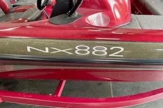 Slide: The Image of 2002 Nitro NX 882 SC boat, red exterior, close-up view. - 6