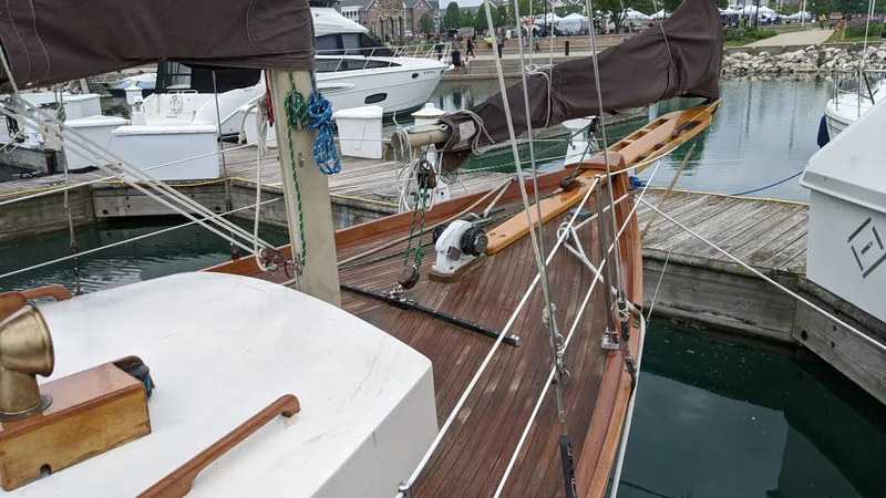 Slide: The Image of 1980 Ted Brewer Lazy Jack sailboat docked in harbor. - 11