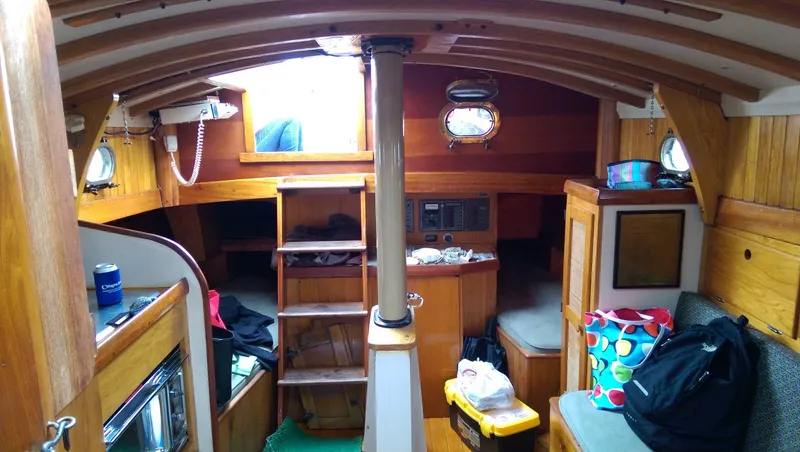 Slide: The Image of Interior of a 1980 Ted Brewer Lazy Jack yacht with wooden furnishings. - 13