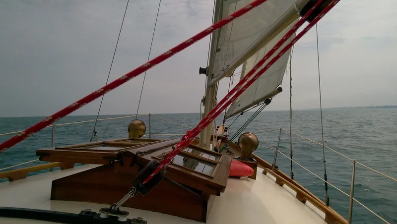Slide: The Image of Ted Brewer Lazy Jack 1980 sailboat on open sea. - 7