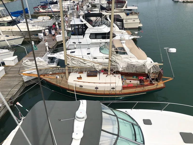 Slide: The Image of 1980 Ted Brewer Lazy Jack sailboat docked in marina. - 8