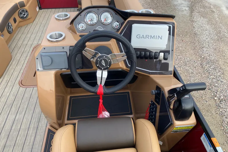 Slide: The Image of Steering console of 2026 SunCatcher Fusion 324RC with Garmin navigation system. - 10