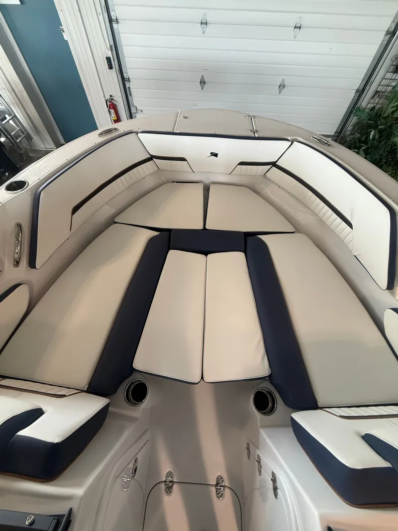 Slide: The Image of Interior view of 2026 Stingray 20SBX boat with cushioned seating. - 12