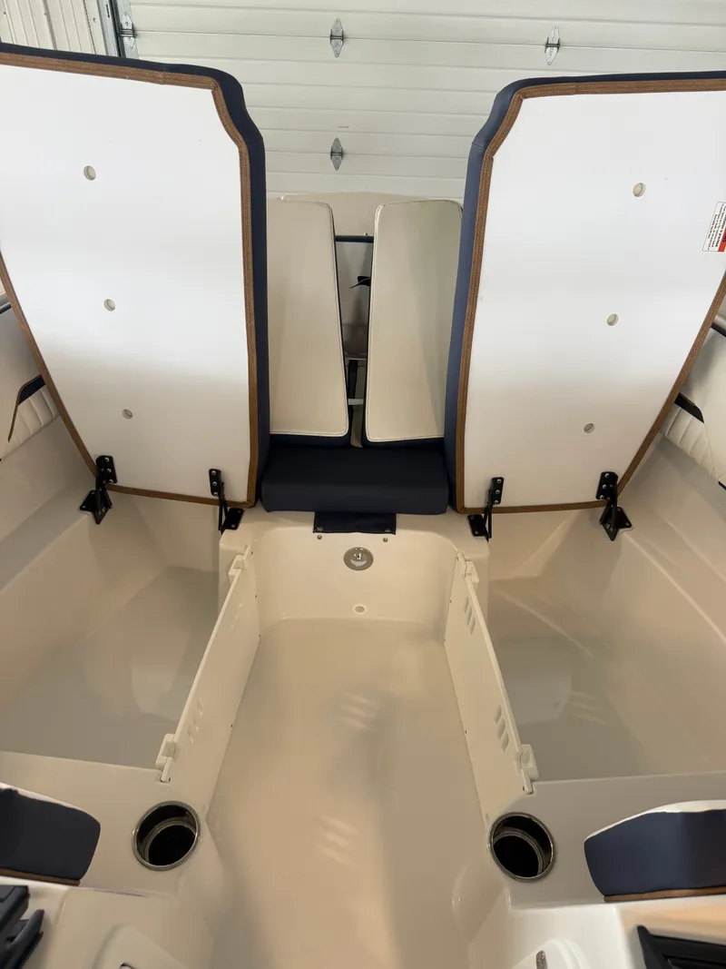 Slide: The Image of Interior of 2026 Stingray 20SBX with open storage compartments. - 13