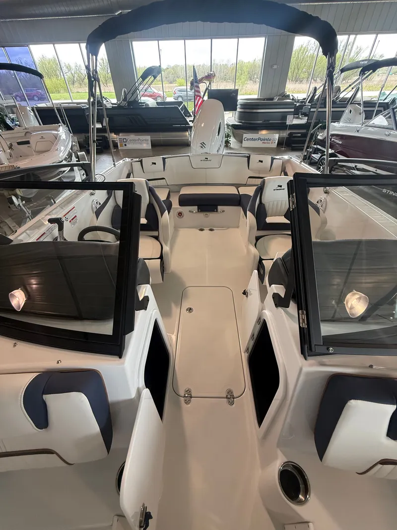 Slide: The Image of Interior view of 2026 Stingray 20SBX boat in showroom. - 3