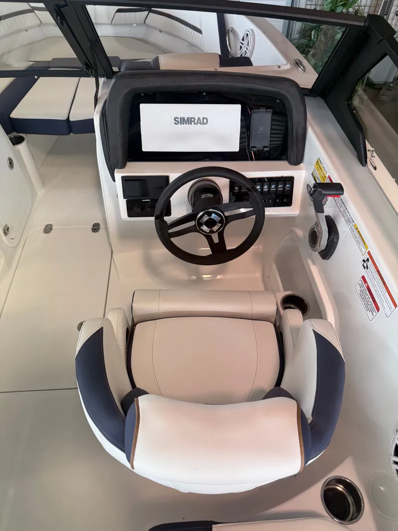 Slide: The Image of Interior view of 2026 Stingray 20SBX boat cockpit with Simrad controls. - 5