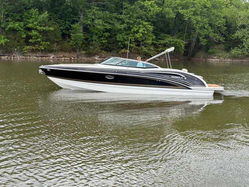 The Image of 2016 Formula 310 BR boat on a calm lake. - 0