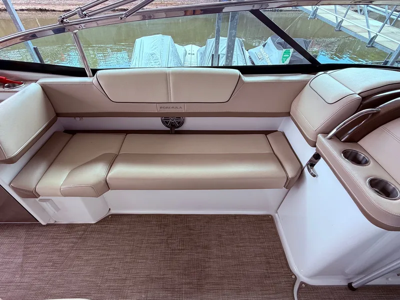 Slide: The Image of Interior of a 2016 Formula 310 BR boat with beige seating. - 10