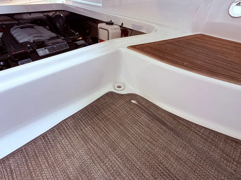 Slide: The Image of Interior of a 2016 Formula 310 BR boat with engine view. - 12