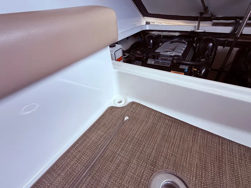 Slide: The Image of Engine compartment of a 2016 Formula 310 BR boat with carpeted floor. - 13