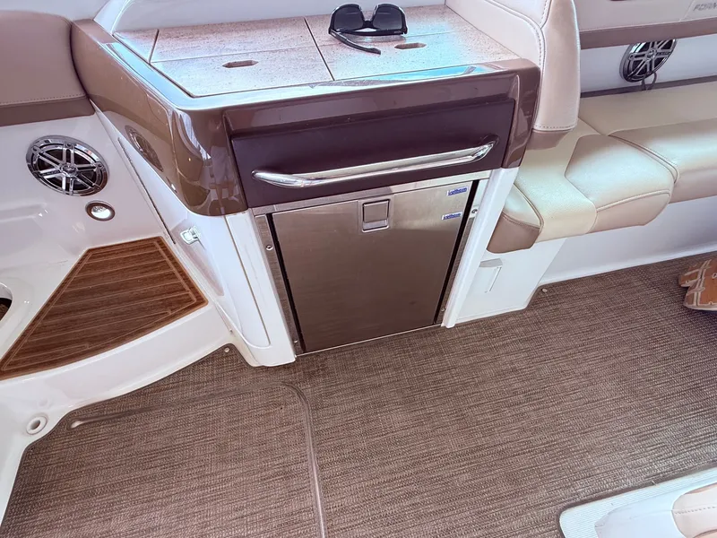 Slide: The Image of Interior of a 2016 Formula 310 BR boat with refrigerator. - 15