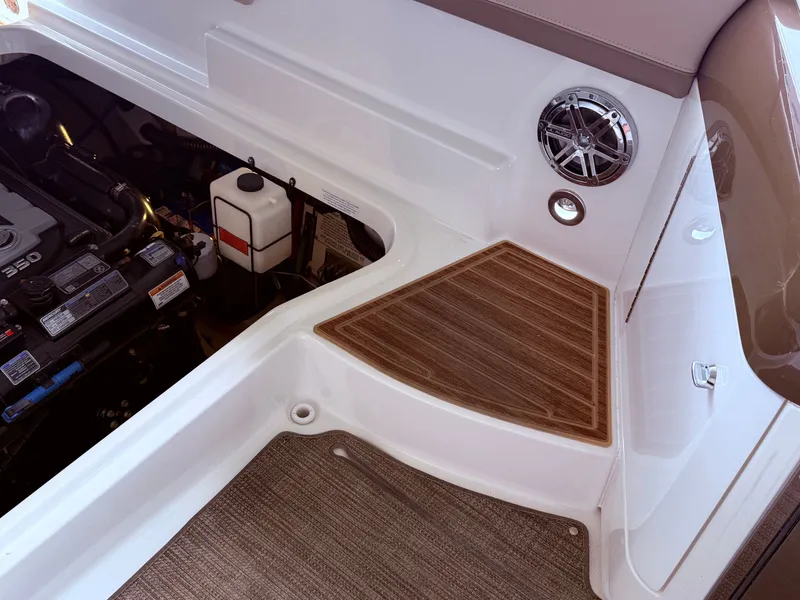 Slide: The Image of Interior of a 2016 Formula 310 BR boat with engine view. - 18