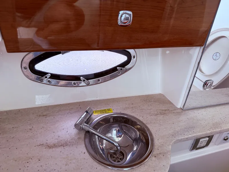 Slide: The Image of Interior of 2016 Formula 310 BR with sink and porthole. - 21