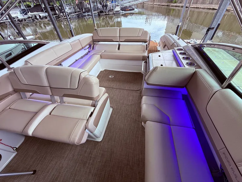 Slide: The Image of Interior of a 2016 Formula 310 BR boat with blue lighting. - 22