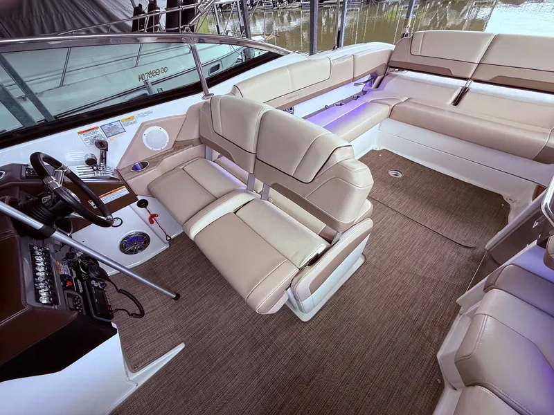 Slide: The Image of Interior of a 2016 Formula 310 BR boat with beige seating. - 23