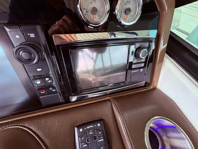 Slide: The Image of Dashboard of a 2016 Formula 310 BR with controls and display. - 25