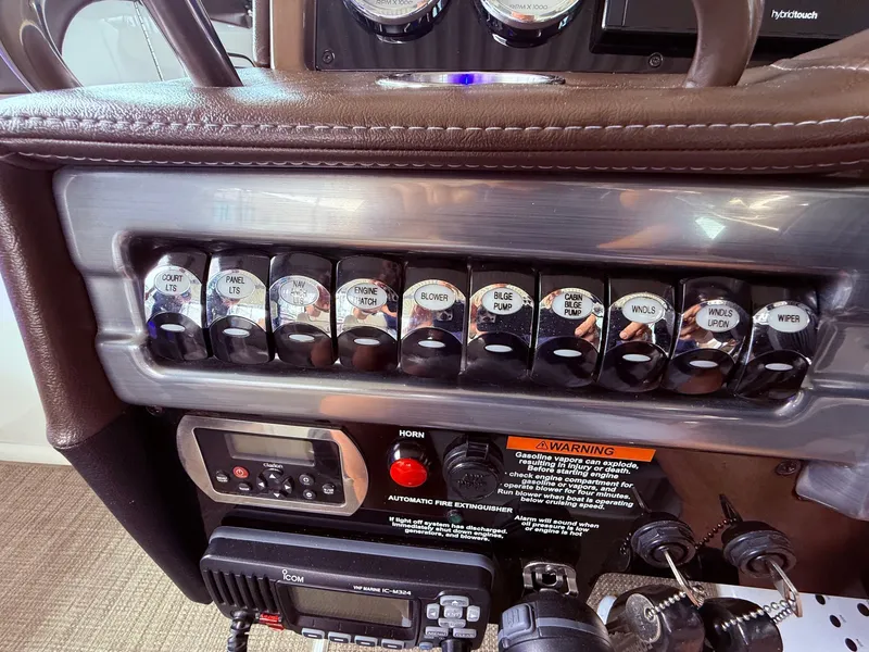 Slide: The Image of Dashboard of a 2016 Formula 310 BR boat with switches and gauges. - 27