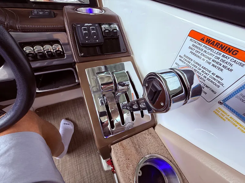Slide: The Image of Interior of a 2016 Formula 310 BR boat with controls and warning labels. - 28