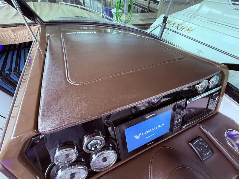 Slide: The Image of Dashboard of a 2016 Formula 310 BR boat with leather trim. - 29