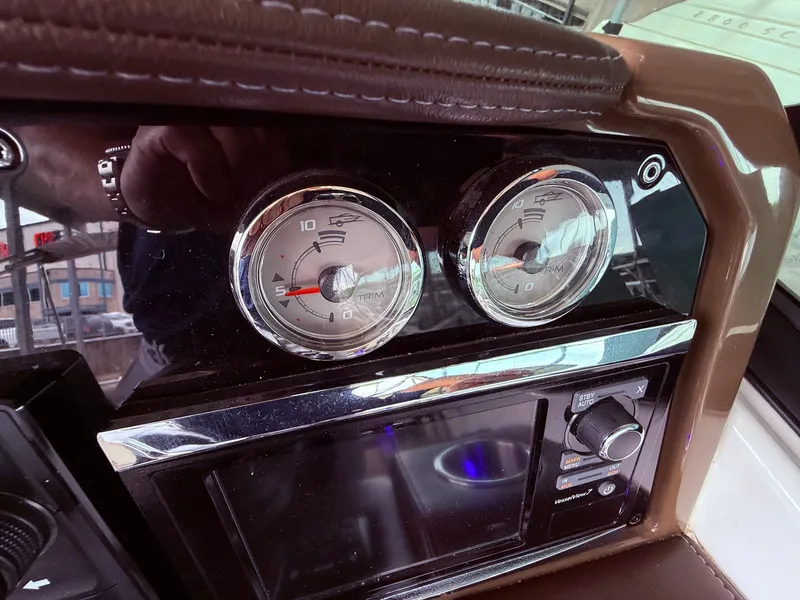Slide: The Image of Dashboard of 2016 Formula 310 BR with trim gauge. - 30