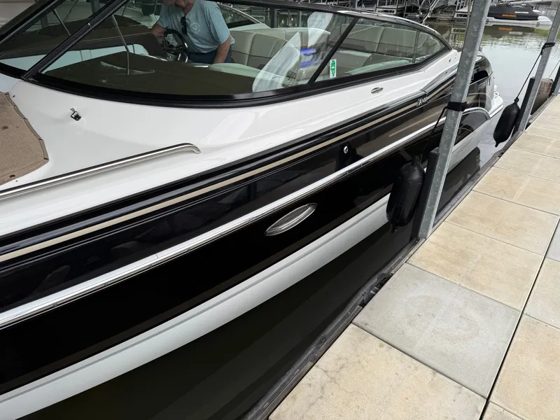 Slide: The Image of 2016 Formula 310 BR boat docked at marina. - 32