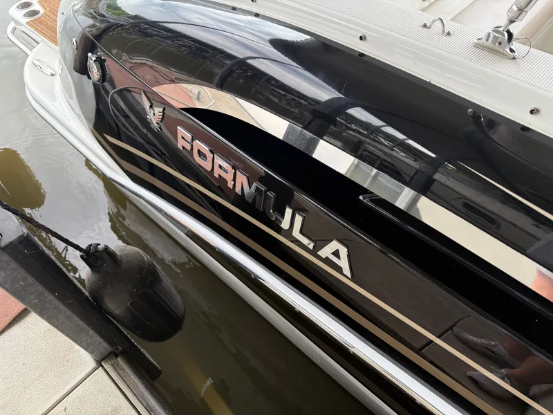 Slide: The Image of Black 2016 Formula 310 BR boat docked. - 33