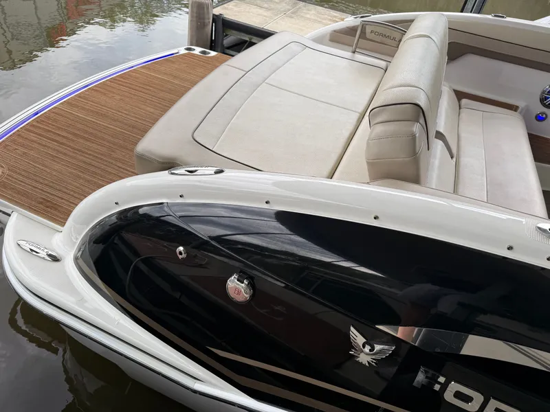 Slide: The Image of 2016 Formula 310 BR boat with sleek interior by the water. - 34