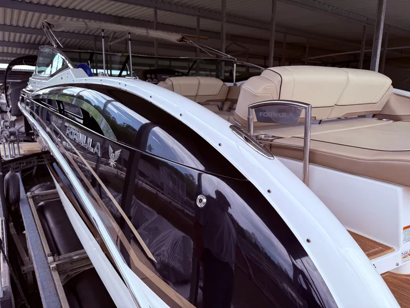 Slide: The Image of 2016 Formula 310 BR boat in a covered dock. - 8