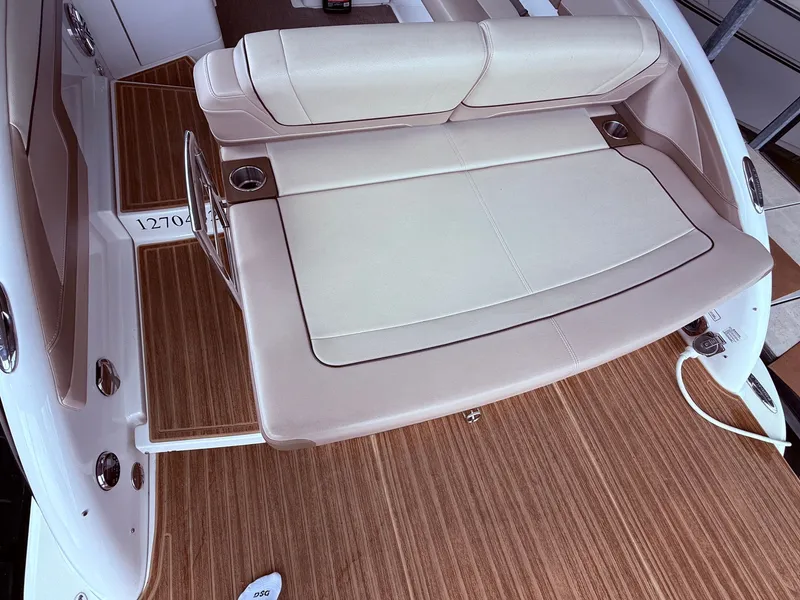 Slide: The Image of Interior of a 2016 Formula 310 BR boat with beige seating area. - 9