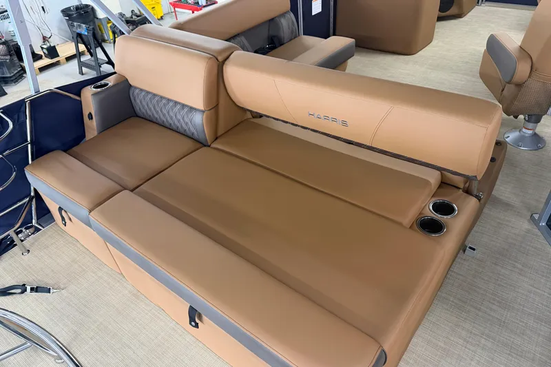 Slide: The Image of 2026 Harris Cruiser 190 SL boat interior with tan leather seating and cup holders. - 10