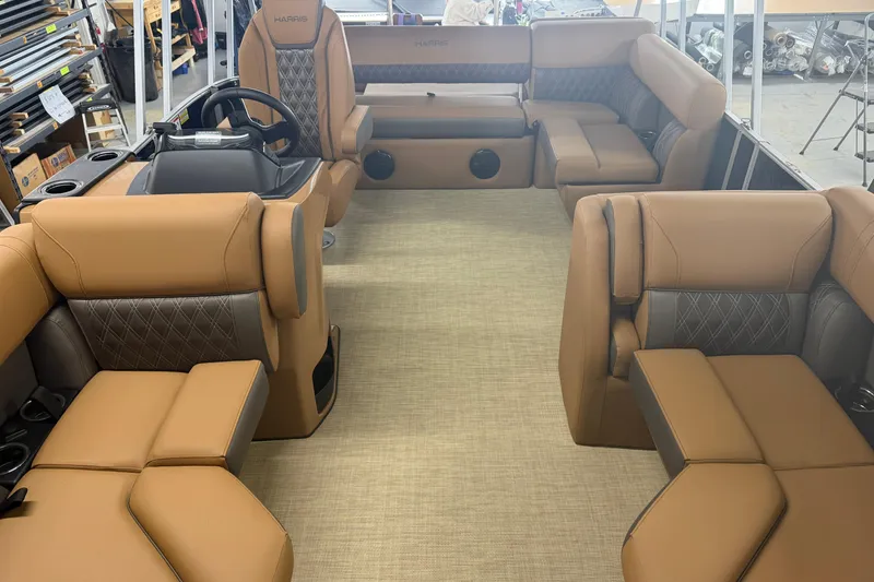 Slide: The Image of 2026 Harris Cruiser 190 SL interior with tan leather seating and modern design. - 2