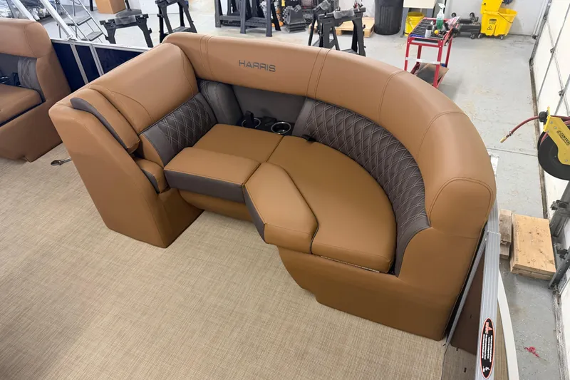Slide: The Image of Luxurious seating on 2026 Harris Cruiser 190 SL boat, featuring brown and gray upholstery. - 3