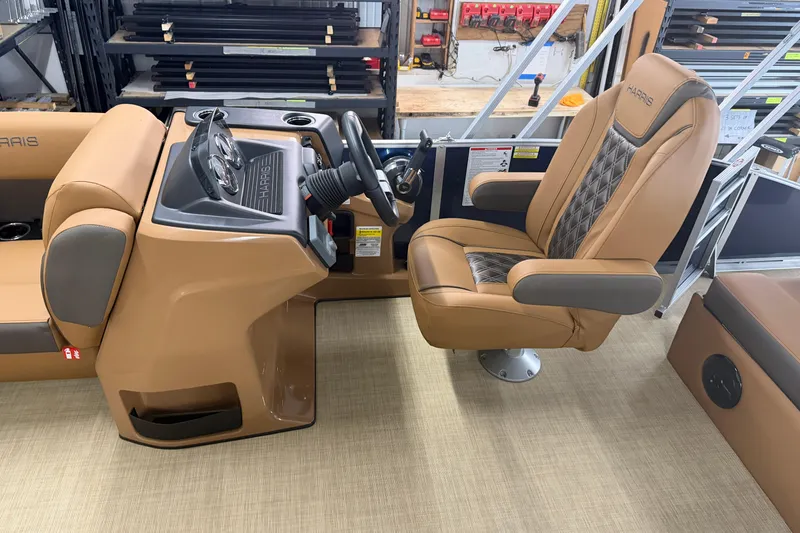 Slide: The Image of 2026 Harris Cruiser 190 SL boat interior with tan captain's chair and steering console. - 5