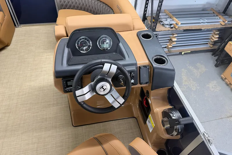 Slide: The Image of Steering console of 2026 Harris Cruiser 190 SL boat with gauges and cup holders. - 7