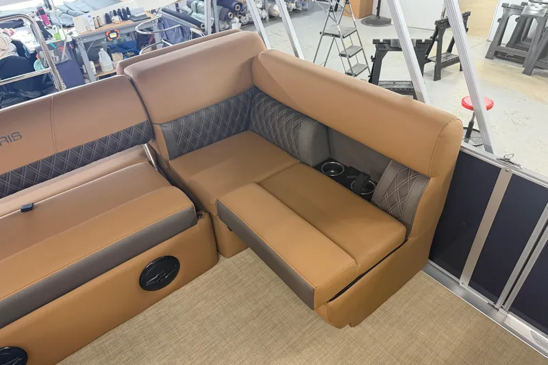 Slide: The Image of 2026 Harris Cruiser 190 SL boat interior with tan leather seating and cup holders. - 8