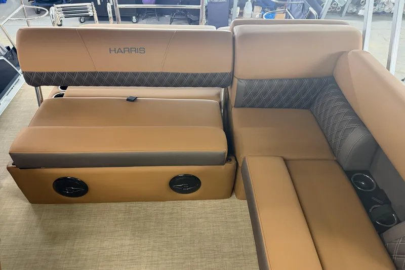 Slide: The Image of Luxurious seating on 2026 Harris Cruiser 190 SL boat, featuring tan and gray upholstery. - 9