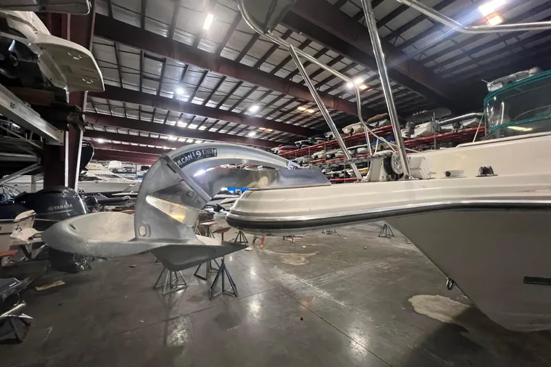 Slide: The Image of 1995 Rinker Fiesta Vee 265 boat in indoor storage facility. - 2