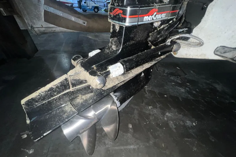 Slide: The Image of Close-up of a 1995 Rinker Fiesta Vee 265 boat's MerCruiser outdrive with propeller. - 21