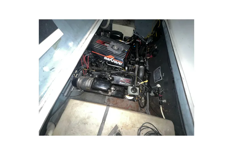 Slide: The Image of Engine compartment of a 1995 Rinker Fiesta Vee 265 with MerCruiser components. - 24
