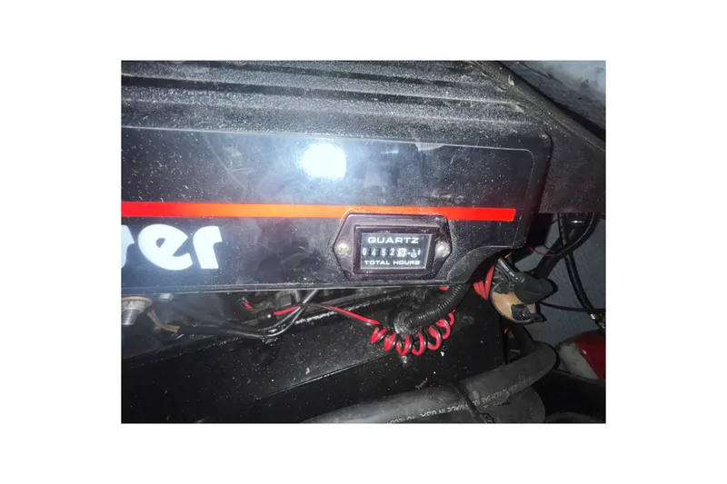 Slide: The Image of Engine compartment of 1995 Rinker Fiesta Vee 265 with hour meter display. - 25