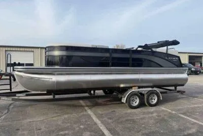 Slide: The Image of 2026 Lowe SS 230 WV pontoon boat on trailer in parking lot. - 2
